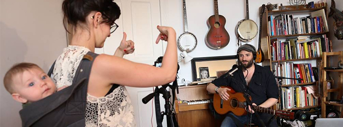 Photo of musician and family in home office.