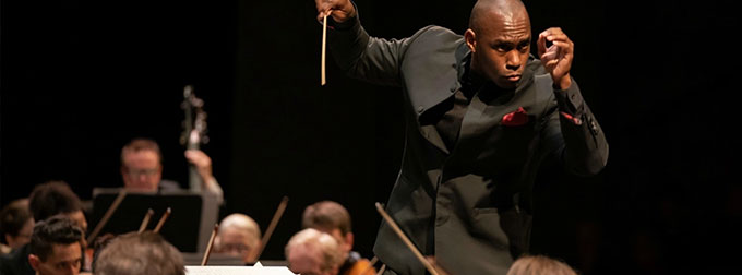 Photo of symphony music conductor.