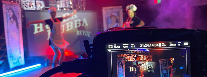 Photo of a studio with performers being recorded.